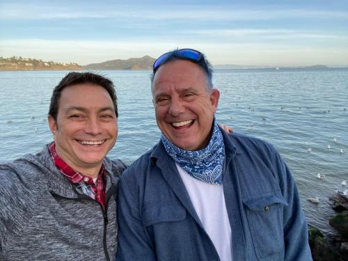 Your hosts, Brian Roth and Dan Miller, by the water