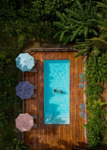 Top-down view of the pool with colorful umbrellas
